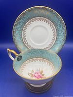 Teacup and saucer front view displaying pattern and shape