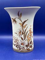 Front view of flared porcelain vase with floral design