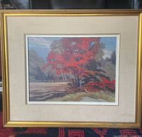 Entire framed painting with linen mat and gold frame visible