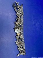 Full view of sterling charm bracelet showing length and density of charms