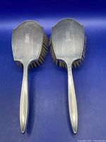 Two sterling silver hair brushes front view