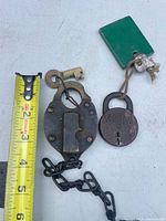 Both padlocks, keys, tape for scale