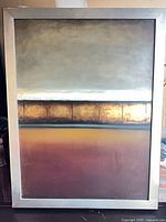 Full view of framed abstract painting showing colors and frame