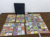 Binder and all eight sheets of Pokémon foil cards laid out for overview