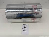 Side view of aluminum foil roll with printed text