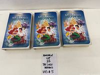 Front view of three Little Mermaid VHS tapes in clamshell cases