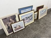 All six framed prints lined up against wall