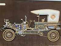 front view of entire framed assemblage showing steampunk car and Chrysler 1924 plaque
