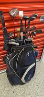 Full view of bag with clubs showing assortment of heads and grips