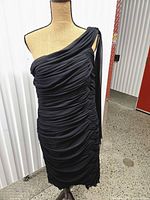 Front view showing one-shoulder design, full ruching