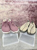 Both pairs side by side on risers