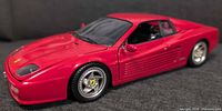 Left front three-quarter view of red Ferrari F512M model car