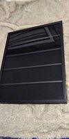 Front view of black wood trading card display case closed