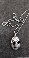 Front view of stainless steel Jason mask pendant on chain