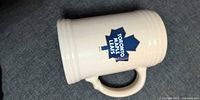 Front view showing Toronto Maple Leafs logo on cream ceramic stein