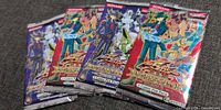Front of four sealed Duelist Pack Yusei 3 booster packs