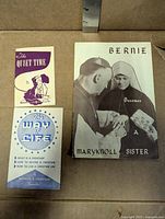 Three pamphlets laid out in box
