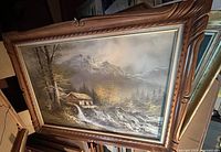 Full view of painting in carved wooden frame