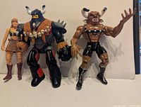 Front view of all three action figures standing