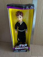 Front view of Sharon Osbourne doll in sealed box