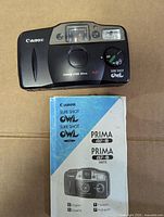 Canon Sure Shot Owl camera with instruction book