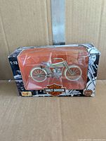 Front view of 1909 Twin 5D in box