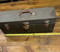 Closed box top view with ruler showing length