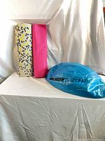 Group shot of two mats and deflated blue cushion