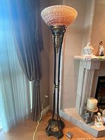 Full view of torchiere lamp showing height, base to shade
