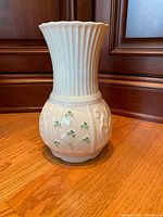 Front view of Belleek Nadine vase showing ribbed neck and shamrock motifs