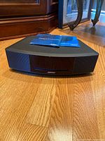 Front view showing slot-loading CD and speaker grilles