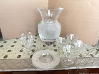 Group shot showing vase, stemware, coupes and plate