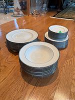 Stacks of dinner plates, salad plates, bowls and bread plates