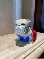 Front view of bulldog figurine on surface