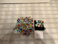 Overall lot showing all marbles on cloth surface