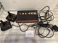 Console, two joysticks, power adapter and AV cable