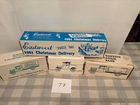 Overview of four boxed die-cast vehicles