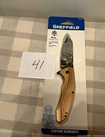 Front view of packaged Sheffield Besa folding knife