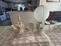 Overall view showing all Snowbabies pieces on table