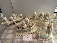 Overview of all four Snowbabies figurine scenes