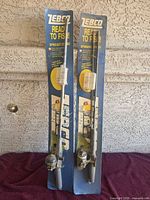 Full view of two sealed Zebco Ready to Fish combos on cards