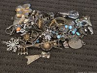 pile of assorted sterling jewelry components
