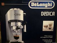 Front of box showing DeLonghi Dedica espresso machine image and branding