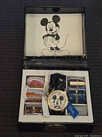 Open presentation box showing watch and six additional straps