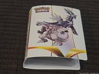 Front of Pokémon mini binder featuring Dialga and Palkia artwork