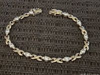 Full view of bracelet laid flat showing entire design and clasp