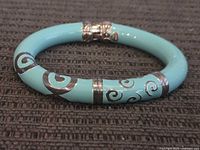 Full view of turquoise bangle with sterling overlay and clasp