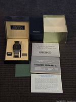 Full set showing watch in box with outer packaging and papers