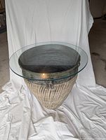 Full view of ceramic pot with glass top resting on it