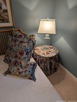 Table with floral cloth and pillows showing pattern and table size